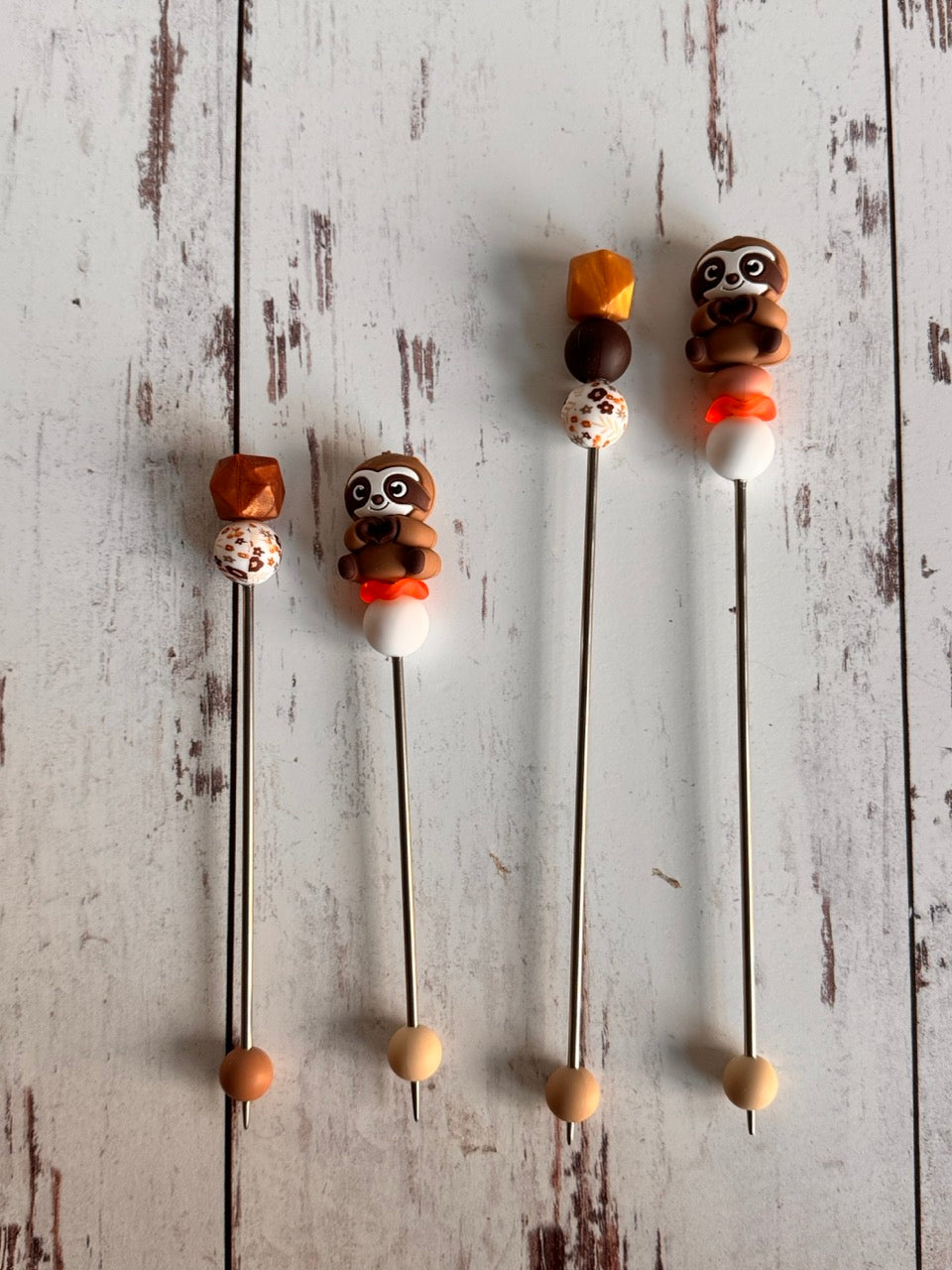 Pair of Brown Sloth Amigurumi Sewing Sticks
