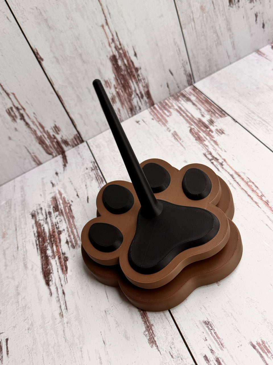 Brown Paw Print Yarn Spinner