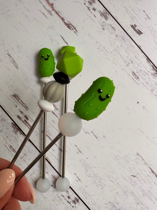 Pair of Cute Green Pickle Amigurumi Sewing Sticks