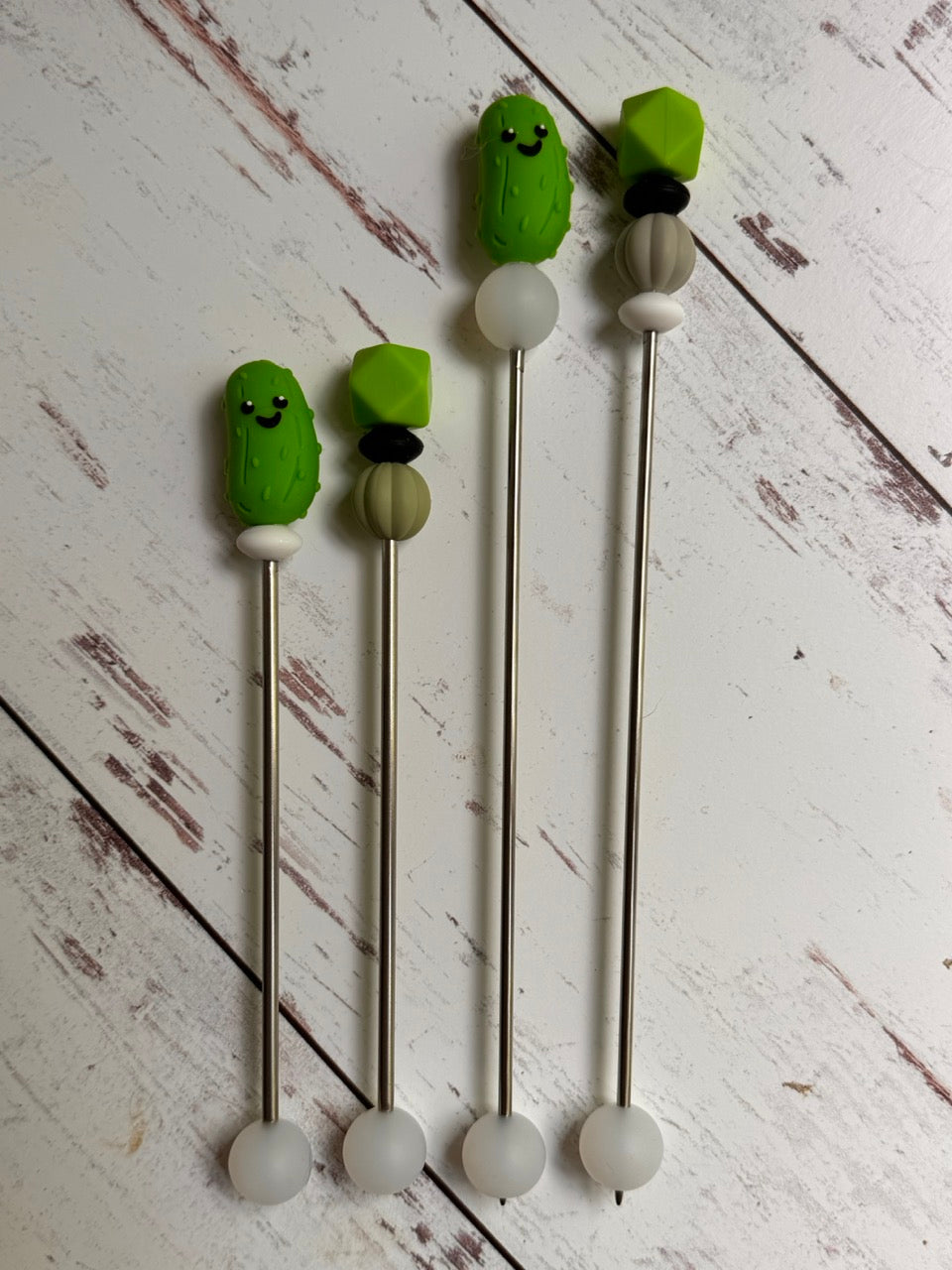 Pair of Cute Green Pickle Amigurumi Sewing Sticks